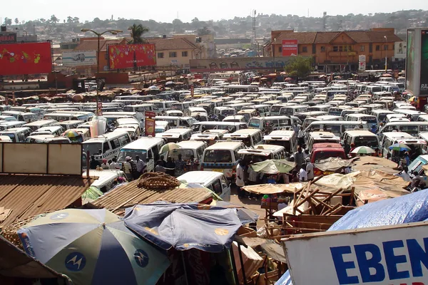 Minibus taxis parked in rows at a busy Kampala taxi park